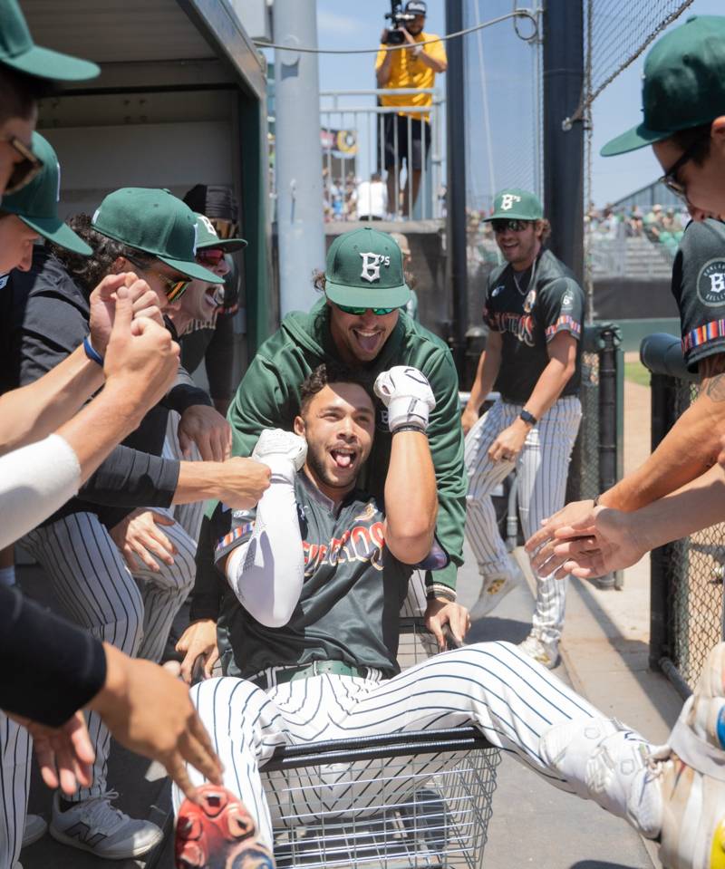 Oakland Ballers players celebrating in the dugout